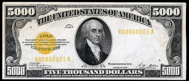 Eine US-amerikanische Fünfausenddollarnote mit einem Porträt von George Washington, auf dem 'Vereinigte Staaten' und 'Fünftausend Dollar' in fetter Schrift stehen.
