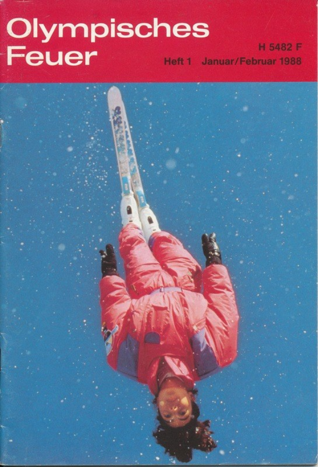 Buchumschlag mit einem Skispringer in der Luft, der eine Skiausrüstung trägt, mit der Aufschrift "Olympische Spiele Feuer - Heft 1 - Januar/Februar 1988" auf dem Cover.